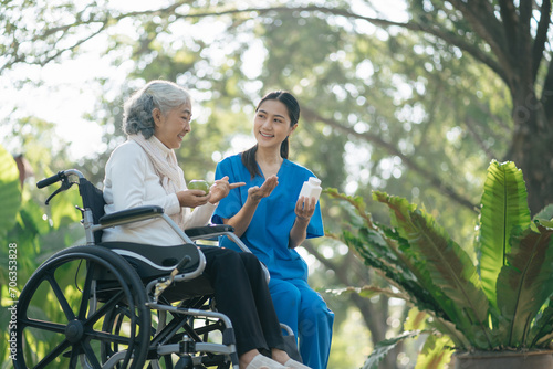 female therapist gives medication advice to an elderly patient.
