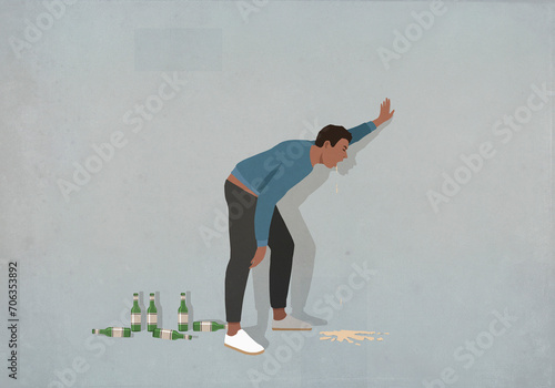 Drunk man vomiting at wall
 photo