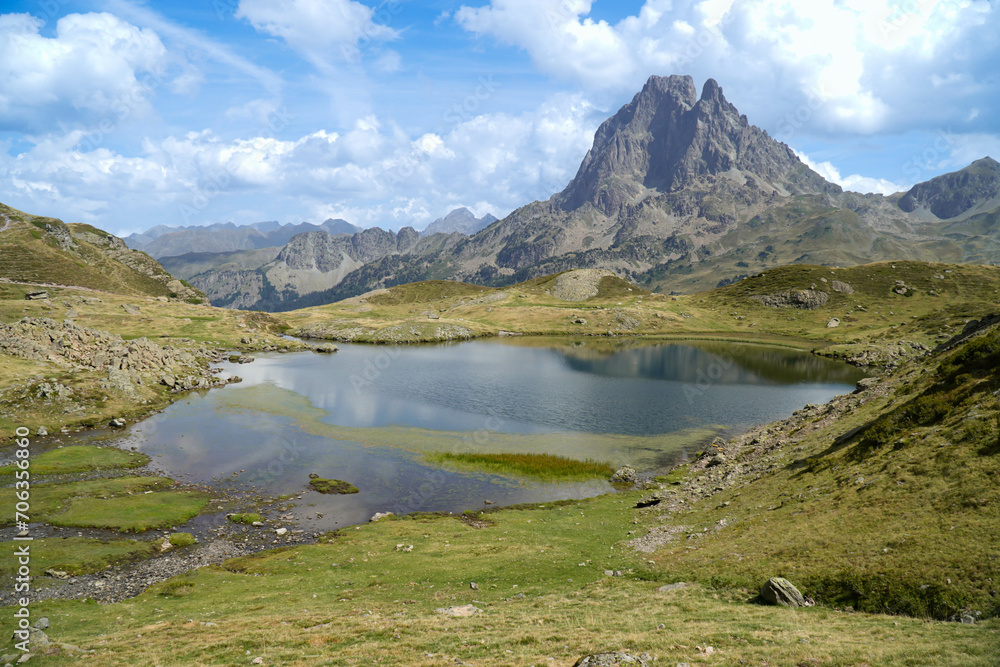 Panoramic view on mountain lake in front of mountain in the pyrenees