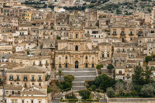 Cityscape with the Duomo di San Giorgio (Cathedral of St George), a Baroque church in Modica, Ragusa, Sicily, Italy. 