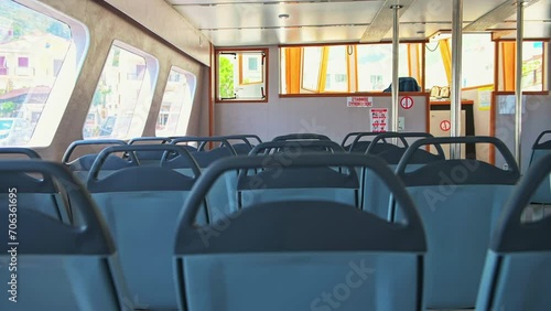 Ferry boat at Agios Kirykos of Ikaria island, Greece inside interior of public transportation transport with sign 