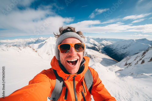 Adventurer taking a selfie on a snowy mountain peak, exuding energy and joy.