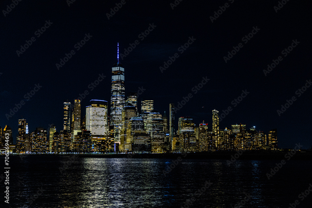 Stunning view of the New York City skyline at night, beautifully illuminated by lights