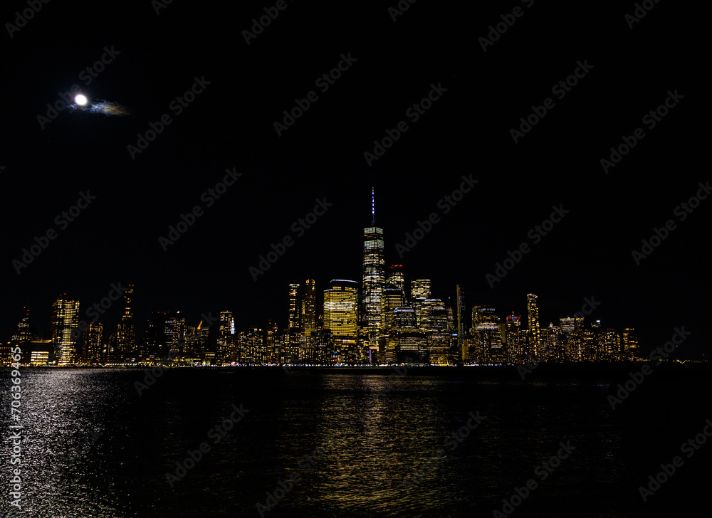 Stunning view of the New York City skyline at night, beautifully illuminated by lights