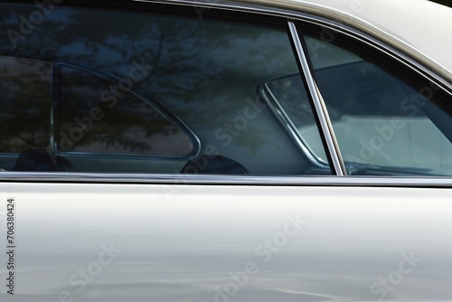 Closeup photo of a new white modern car © Alina