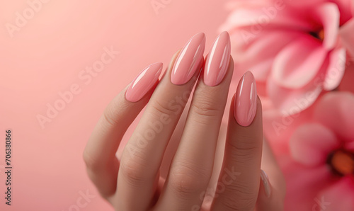 closeup manicure on pink background