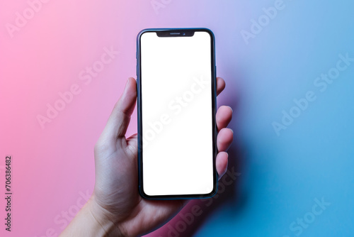 Hand holding modern smartphone with blank screen on gradient background  cut out - stock png. 