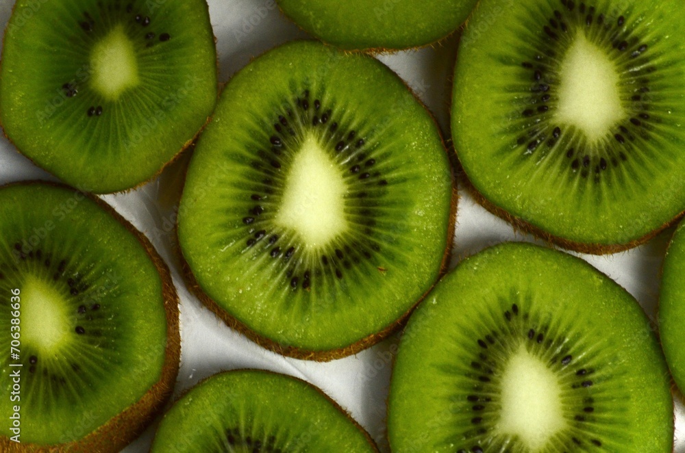 sliced kiwi lies on a white background sliced kiwi lies on a white background