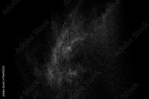 Abstract splashes of water on black background. White explosion. Light overlay texture. 