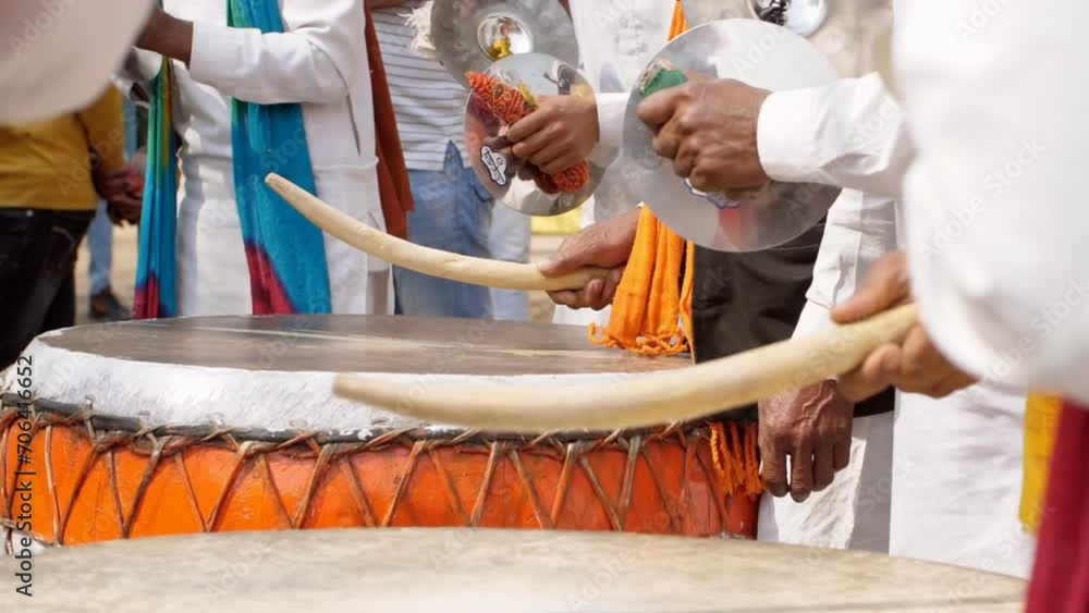 Indian men play traditional drums and musical instruments during ...
