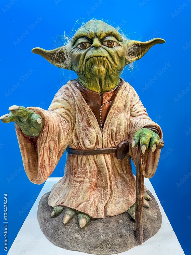 Naklejka premium Madrid, Spain; 01-03-2024: Life-size figure of the iconic character from the Star Wars movie saga Yoda, Grand Master of the Jedi Order
