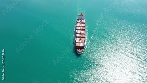 Aerial view Cargo container ship. Business logistic transportation in the ocean ship carrying container,Cargo ship, Cargo container in factory harbor for import-export with copy space for text.  photo