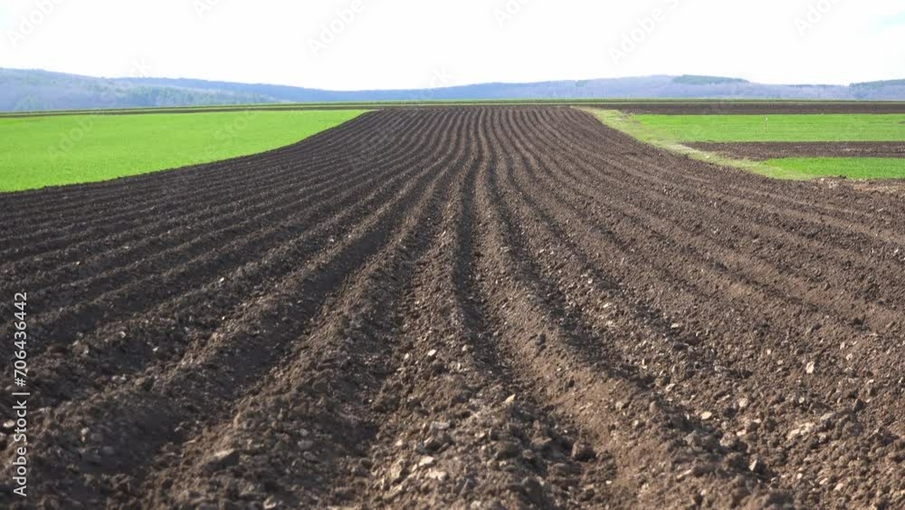 Plowed agriculture field in springtime, zoom out Plowed agriculture field in springtime, zoom out