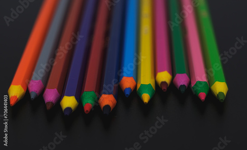 colored pencils on black background