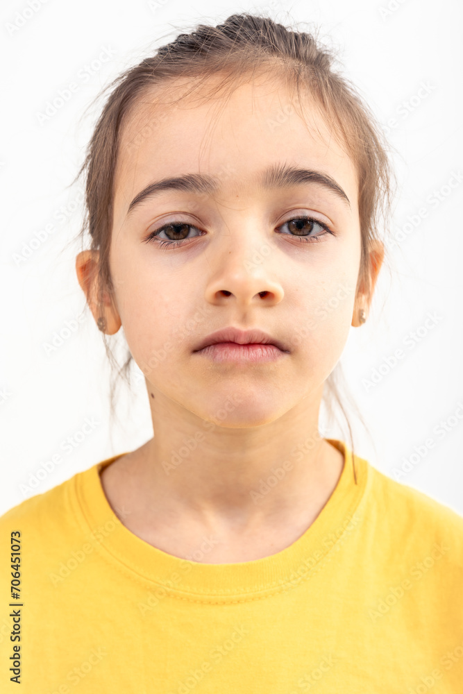 Portrait of girl in yellow t-shirt, isolated on white background. Portrait of girl in yellow t-shirt, isolated on white background.