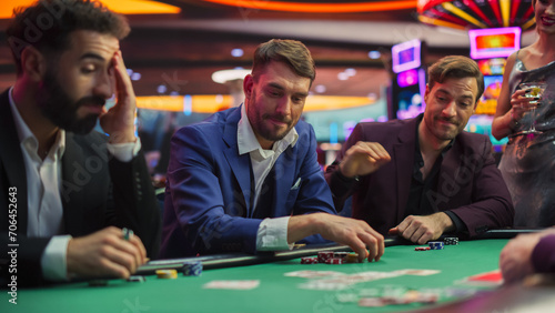Speed Ramp Effect: Intense Win in a Poker Game on a Casino Floor Championship. Handsome Man Has Stronger Hand and Beats Opponents with His Card Deal. Triumphant WInner Shaking Hands and Celebrating photo