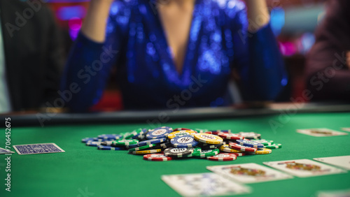 Anonymous Woman in a Glamorous Evening Dress Collecting her Prize of Poker Chips in a Casino. Lucky Professional Lady Winner Hitting the Jackpot, Happilly Celebrating Her Victory. Close-up
