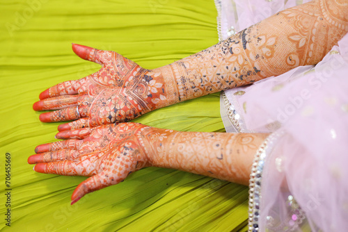 Closeup of decorative mehendi in hands, traditional heena tattoo in hands photo