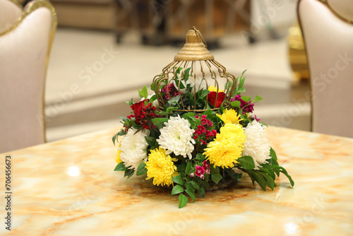 Closuep of fresh flower pot at table in five star hotel photo