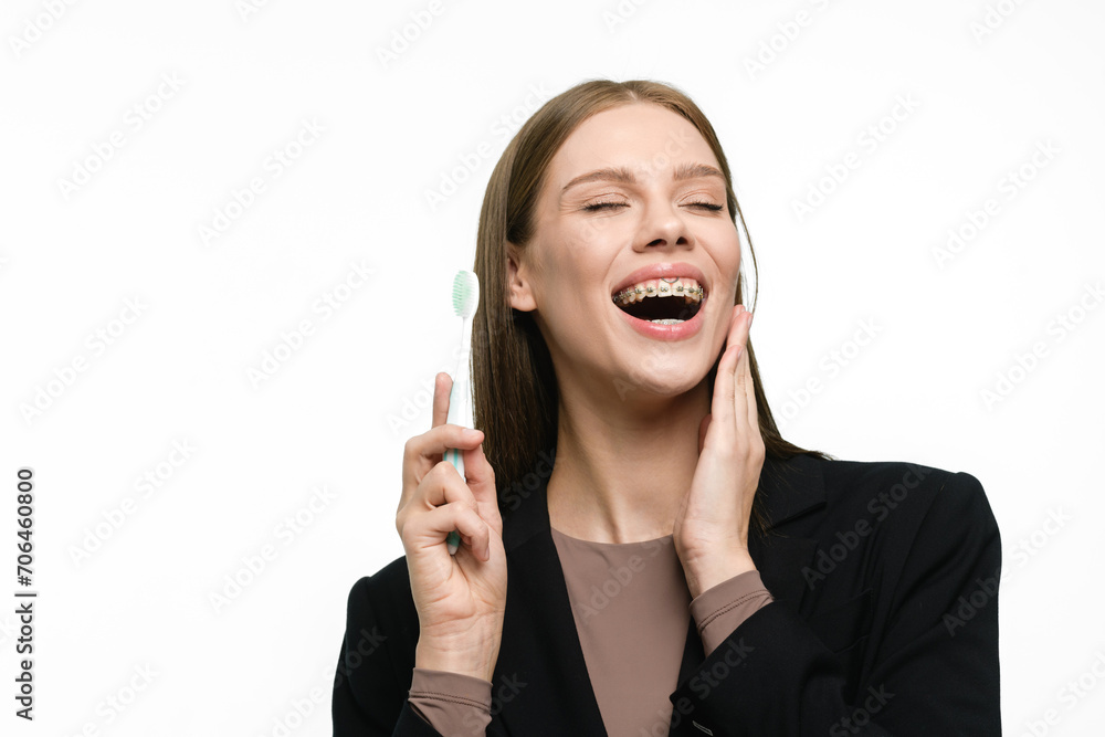 Young beautiful woman with toothbrush isolated on white background Young beautiful woman with toothbrush isolated on white background