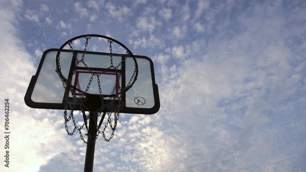 slow motion basketball ring and basketball court on clear sky slow motion basketball ring and basketball court on clear sky