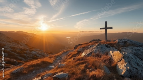 Holy cross the symbol of death and resurrection of Jesus Christ with dramatic sunset. photo