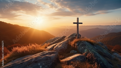 Holy cross the symbol of death and resurrection of Jesus Christ with dramatic sunset. photo