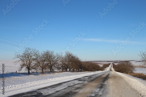 A road with snow on the side © parpalac