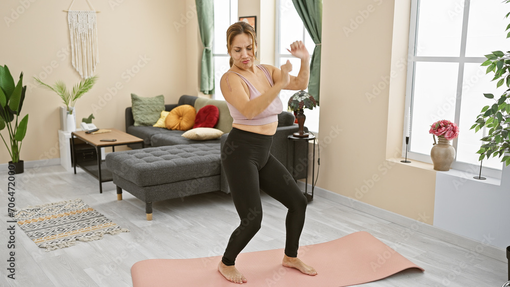 Hispanic woman exercising yoga mat living room indoor fitness wellness Hispanic woman exercising yoga mat living room indoor fitness wellness