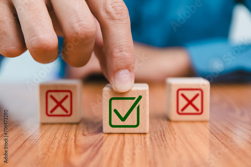 Checklist concept, business person checklist tick answer sign in checkbox, validation online questionnaire quality control document, man use pen to tick correct sign mark in checkbox form. photo