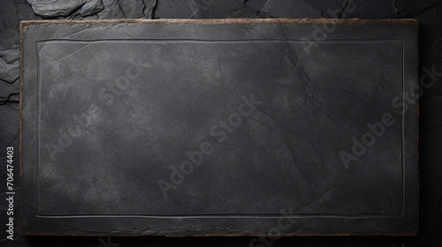 Slate over old wooden background