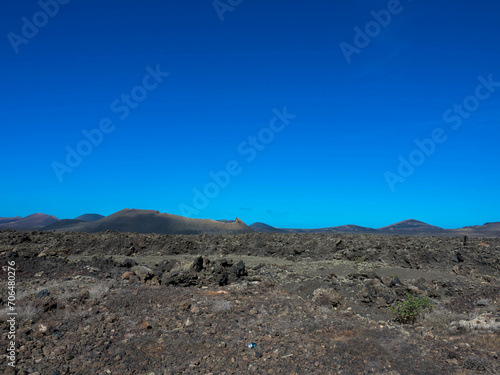 Spectacular views of the Fire Mountains at Timanfaya National Park, this unique area consisting entirely of volcanic soils. A Mars-like volcanic landscape in a sea of ​​lava. Lanzarote, Canary Island