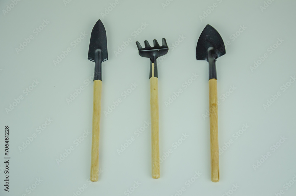 Garden tool rake with shovel on white background Garden tool rake with shovel on white background