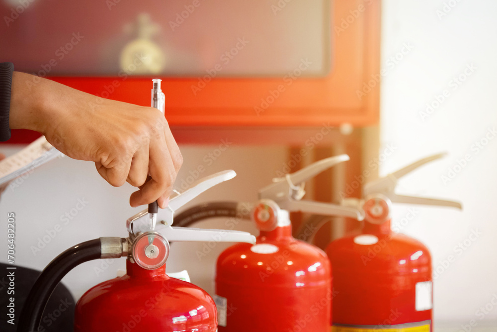 Engineer check fire suppression system,check fire extinguisher tank in the fire control room for safety Engineer check fire suppression system,check fire extinguisher tank in the fire control room for safety