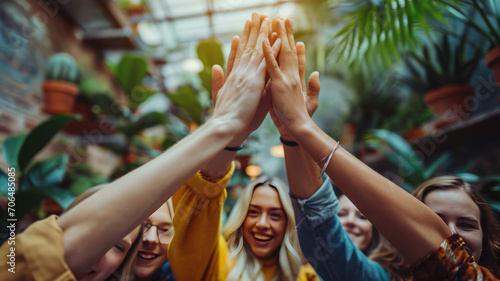 office people high five in the room
