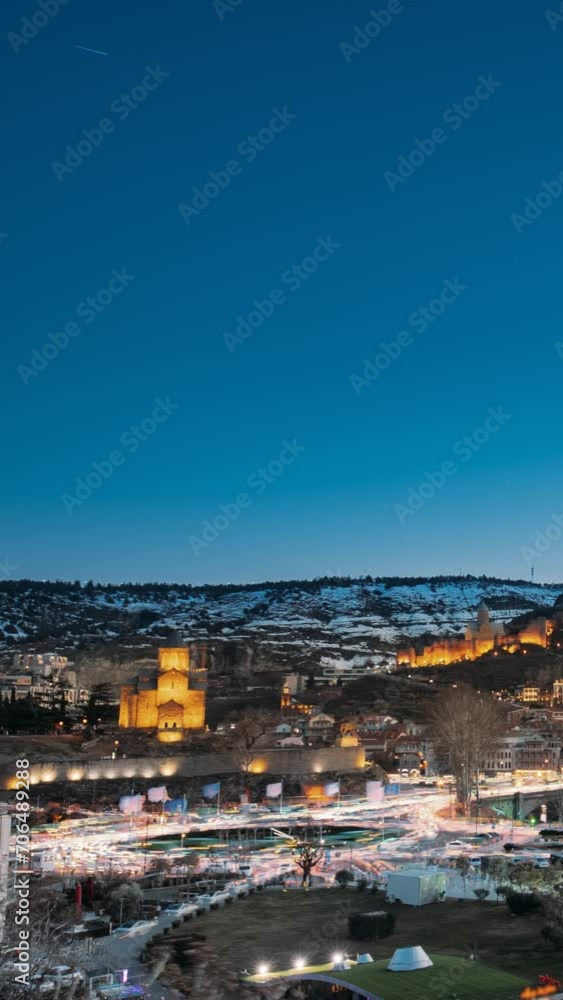Tbilisi, Georgia. Gradual Drawing Of Light Lines. Urban Night Cityscape. Path Of Lights. vertical Timelapse Lines Of Lights. From Dusk To Midnight. Light Line Drawing. Elevated View City Park Rike Tbilisi, Georgia. Gradual Drawing Of Light Lines. Urban Night Cityscape. Path Of Lights. vertical Timelapse Lines Of Lights. From Dusk To Midnight. Light Line Drawing. Elevated View City Park Rike