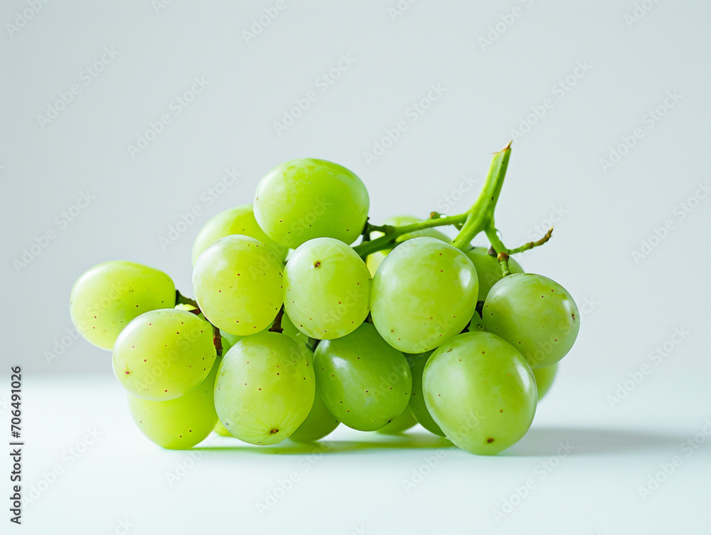 Fresh green grape isolated on white background. Minimalist style. Fresh green grape isolated on white background. Minimalist style.