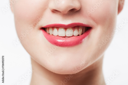 Mouth, teeth and woman with red lipstick, cosmetics or dental for wellness with smile isolated on white background. Lips, makeup and beauty with veneers, oral health and cropped closeup in studio