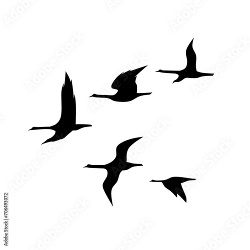 Birds flock silhouette icon vector. Birds flock silhouette can be used as icon, symbol or sign. Birds flock icon for design related to animal, wildlife or landscape © Moleng