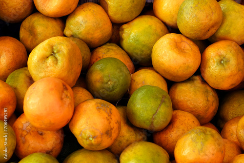 Oranges displayed for sell in a market, very tasty, famously in worldwide. photo