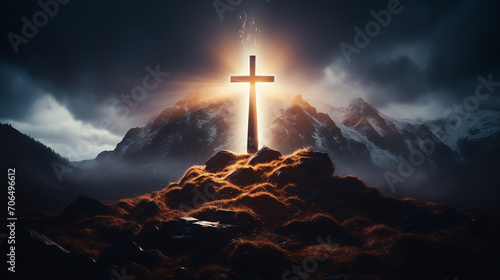 Foto Silhouettes of crucifix symbol on top mountain with bright sunbeam on the colorf