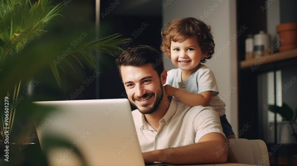 Young working father working with laptop while babysitting his playful child at home. Young working father working with laptop while babysitting his playful child at home.