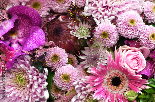 Flowers wall background with amazing pink and purple flowers, hand made Wedding decoration, Valentine or mother´s day background. Colorful flowers mix. Pattern of flowers. 