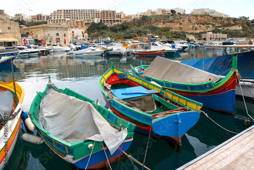 Colorful typical wooden boats in Mgarr, Malta