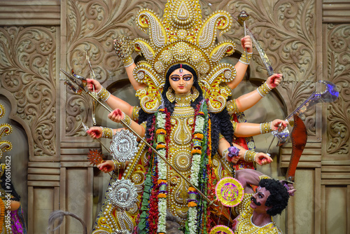 Idol of Goddess Devi Durga at a decorated puja pandal in Kolkata, West Bengal, India. Durga Puja is a popular and major religious festival of Hinduism that is celebrated throughout the world. photo