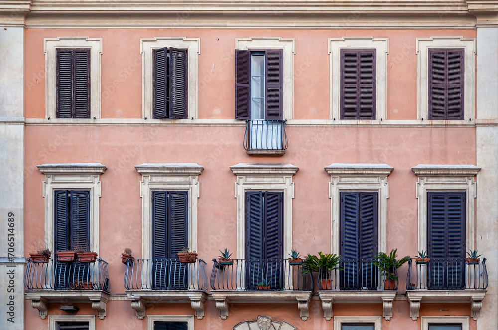 Facade details of beautiful old buildings in the center of Rome, Italy