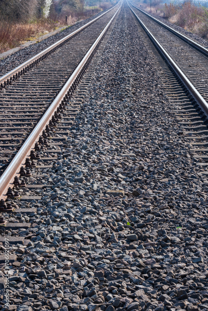 Fototapeta premium Parallel train tracks in a track bed