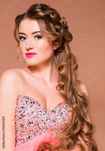 Portrait young beautiful blond woman with long hairdress