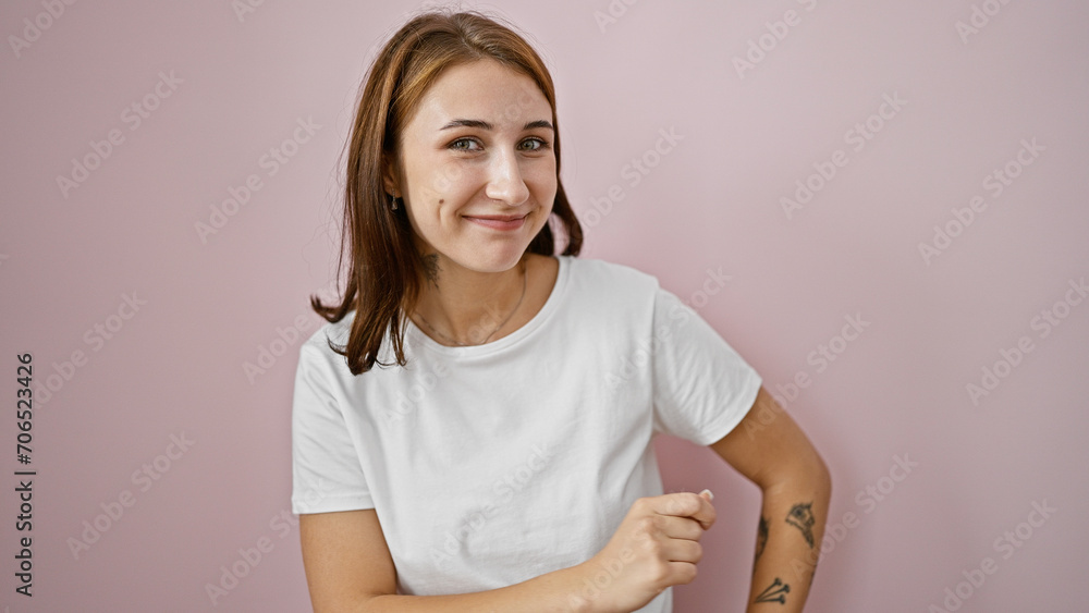 Young woman smiling confident standing over isolated pink background Young woman smiling confident standing over isolated pink background