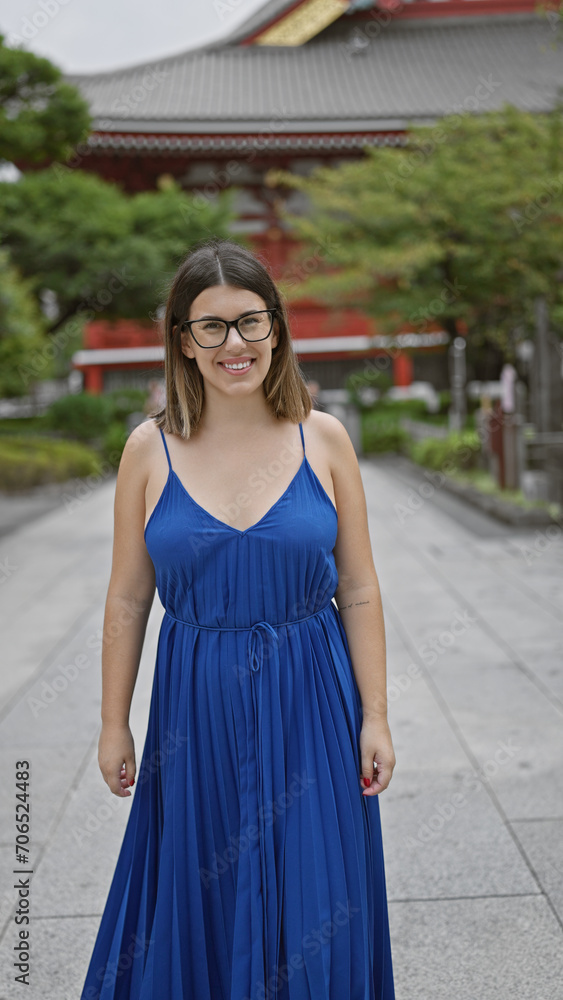 Smiling and joyful, beautiful hispanic woman with glasses posing confidently at the iconic senso-ji shrine in tokyo, exuding natural beauty and carefree happiness Smiling and joyful, beautiful hispanic woman with glasses posing confidently at the iconic senso-ji shrine in tokyo, exuding natural beauty and carefree happiness